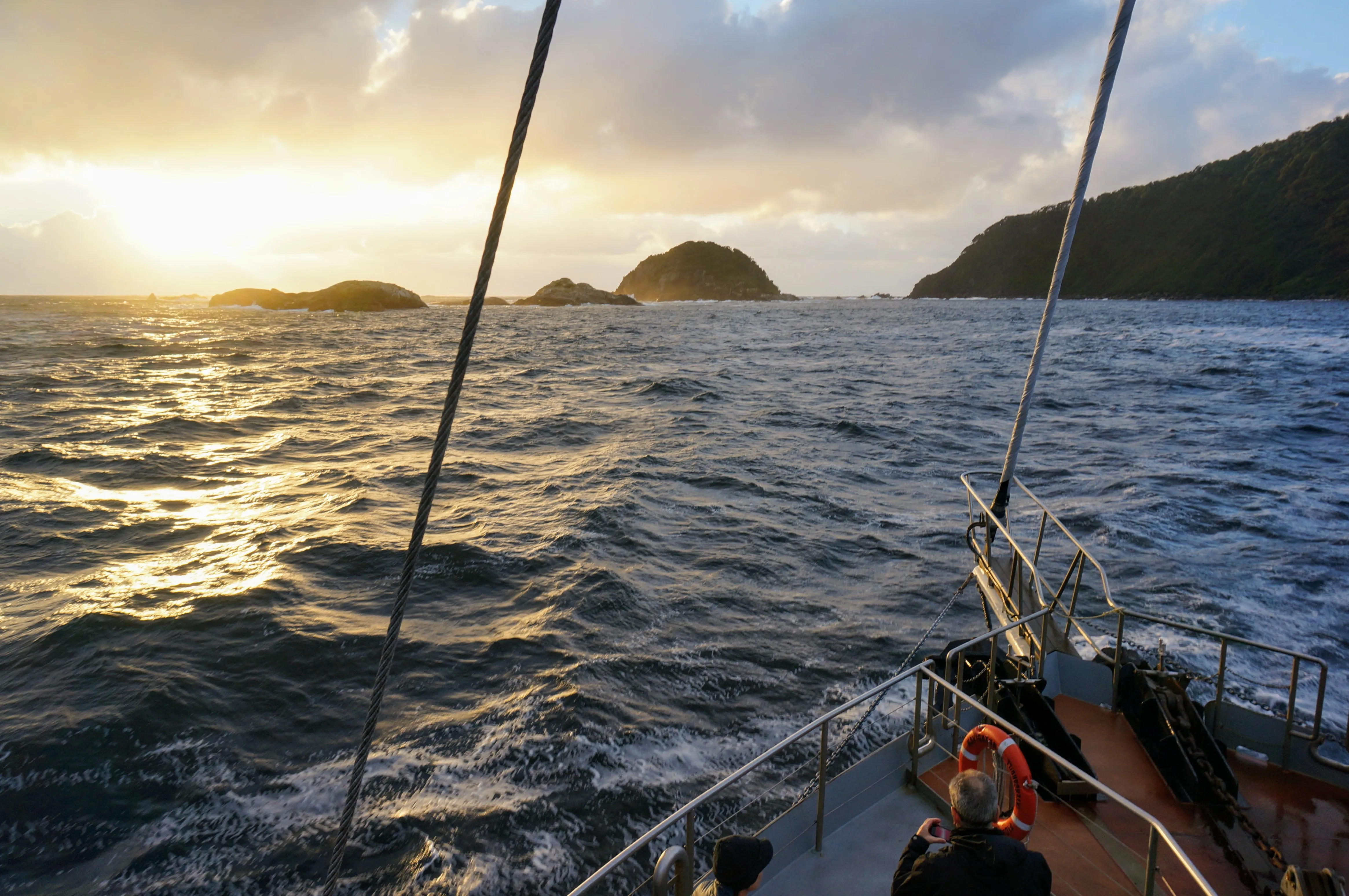 cruise boat approaching rocks.BVz LgF .jpg